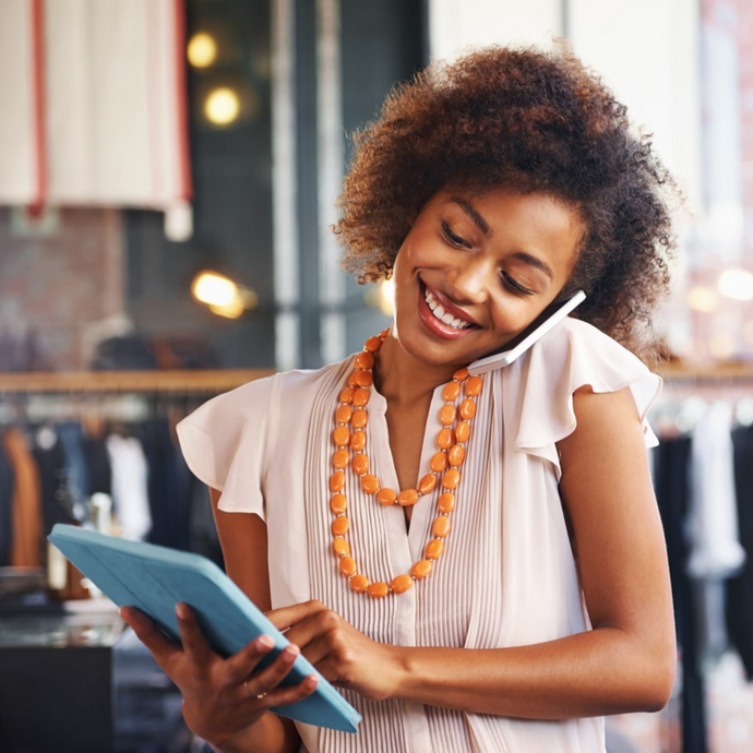 A female employee is using a tablet for procurement, enjoying how simple it is