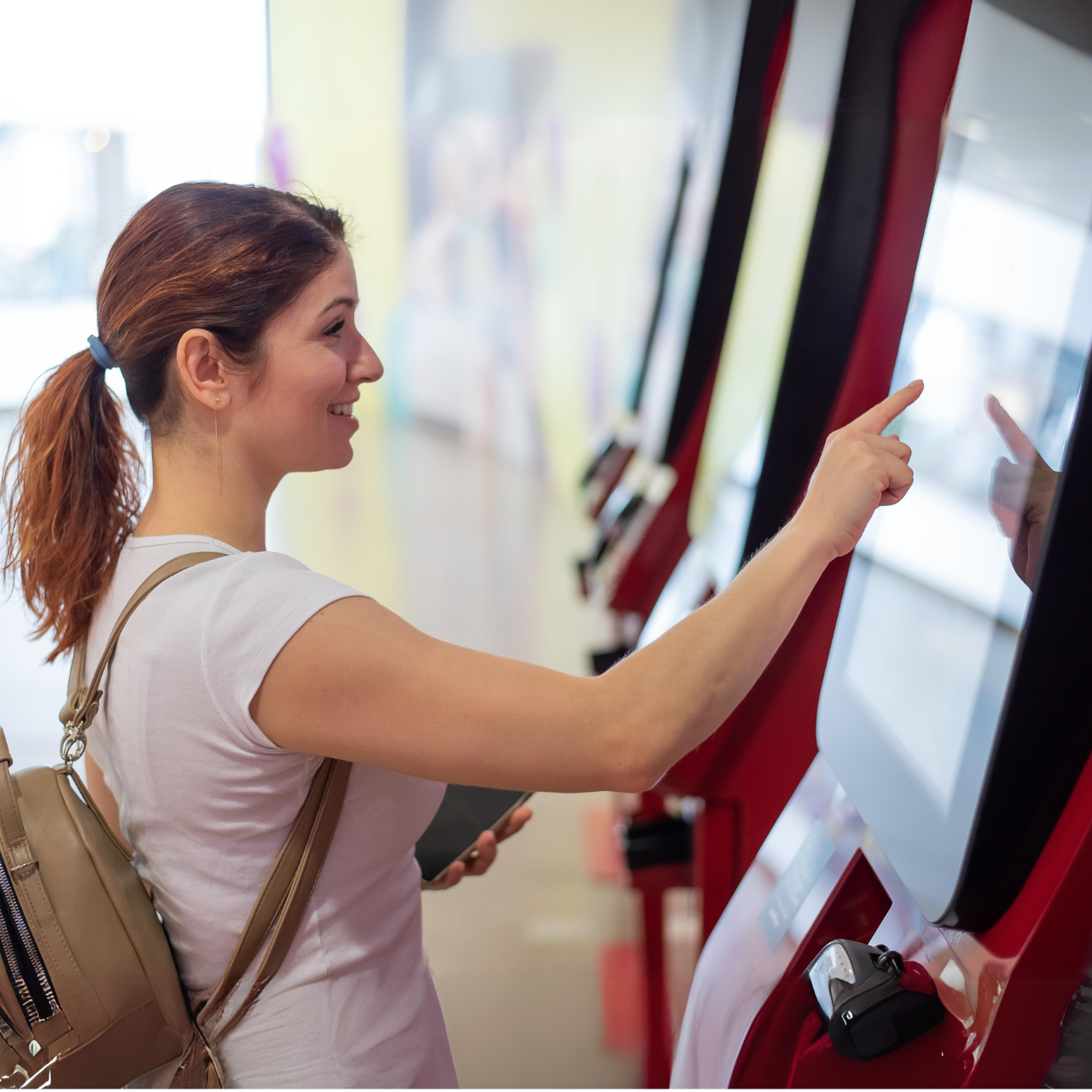 A customer is using a self checkout kiosk to make a payment